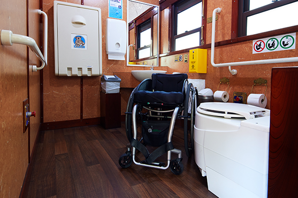 A mobility device in the accessible toilet facility.