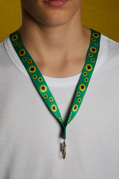 A person wearing the Sunflower Initiative lanyard